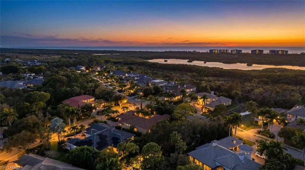 Aerial view at dusk of a water view and a residential view