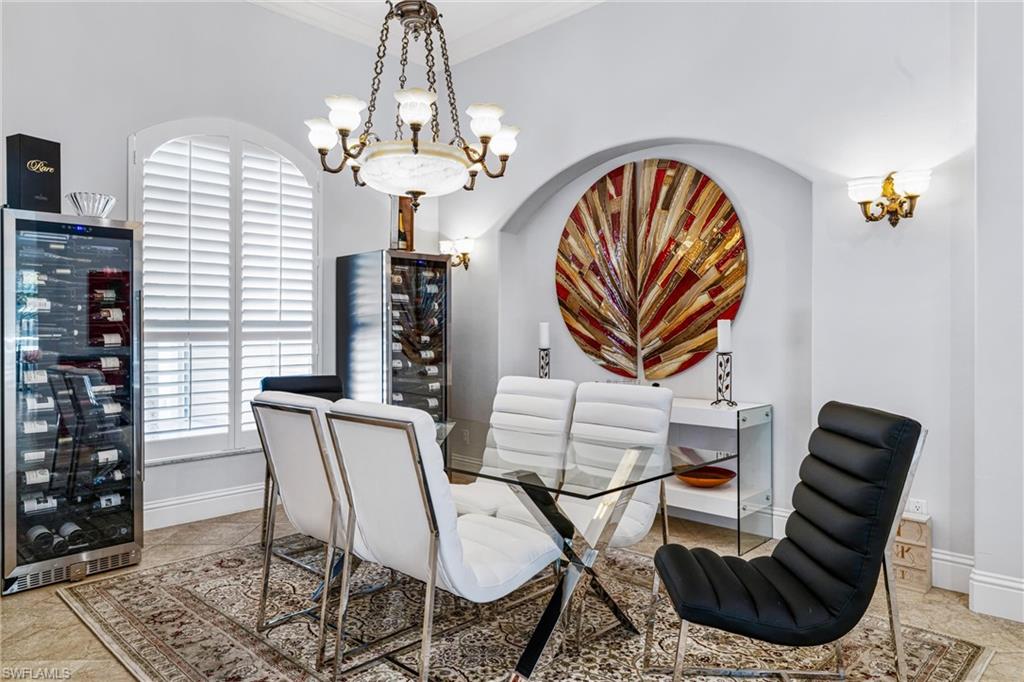 Dining area with beverage cooler and hanging lights