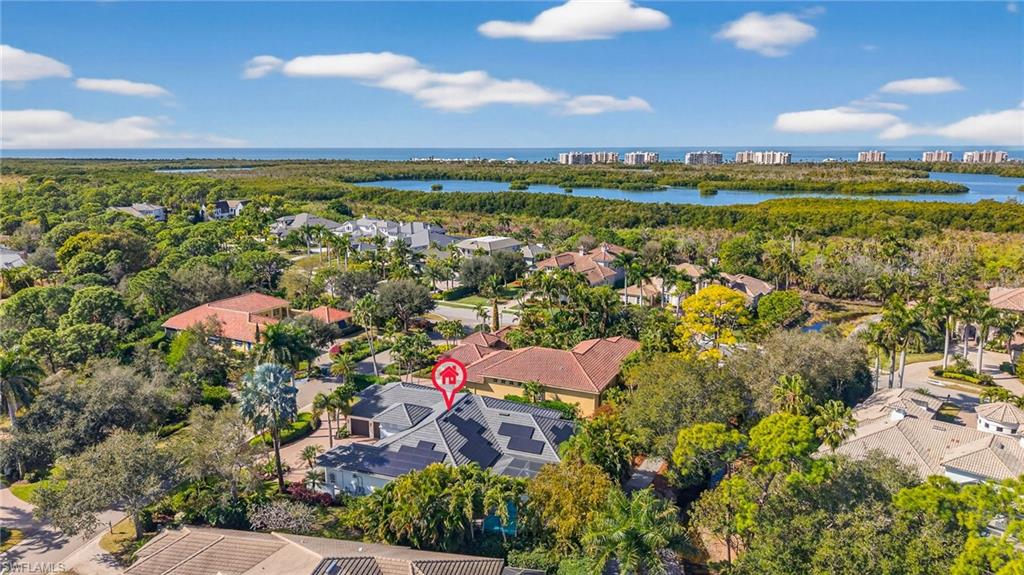 Aerial perspective of suburban area with a nearby body of water