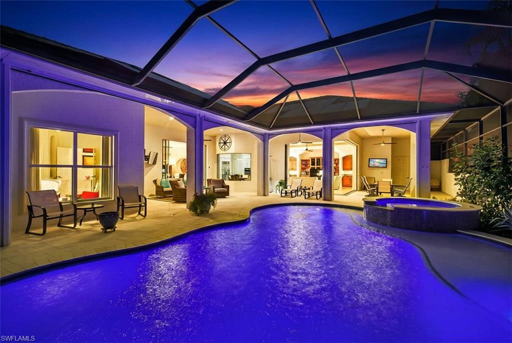 Relaxing pool / spa with a lanai, a patio, and a sunroom