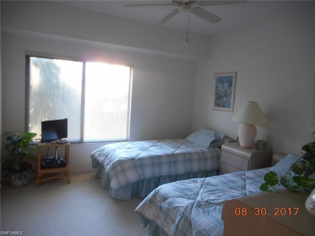 Bedroom featuring carpet floors and ceiling fan