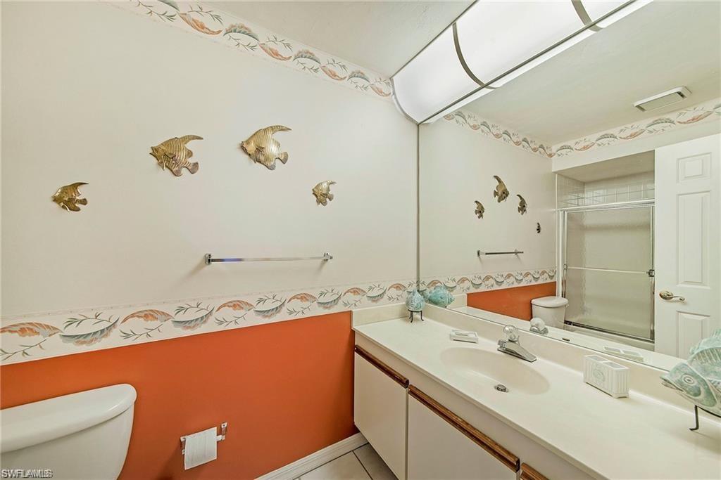 Bathroom with vanity and a shower stall