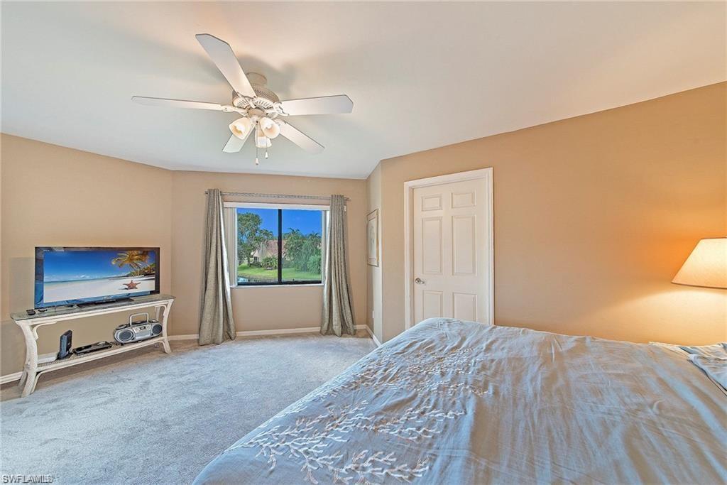 Bedroom with carpet flooring and a ceiling fan