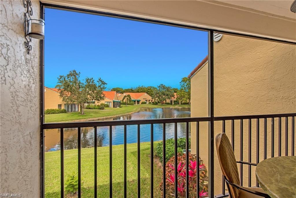 Balcony featuring a water view and a sunroom