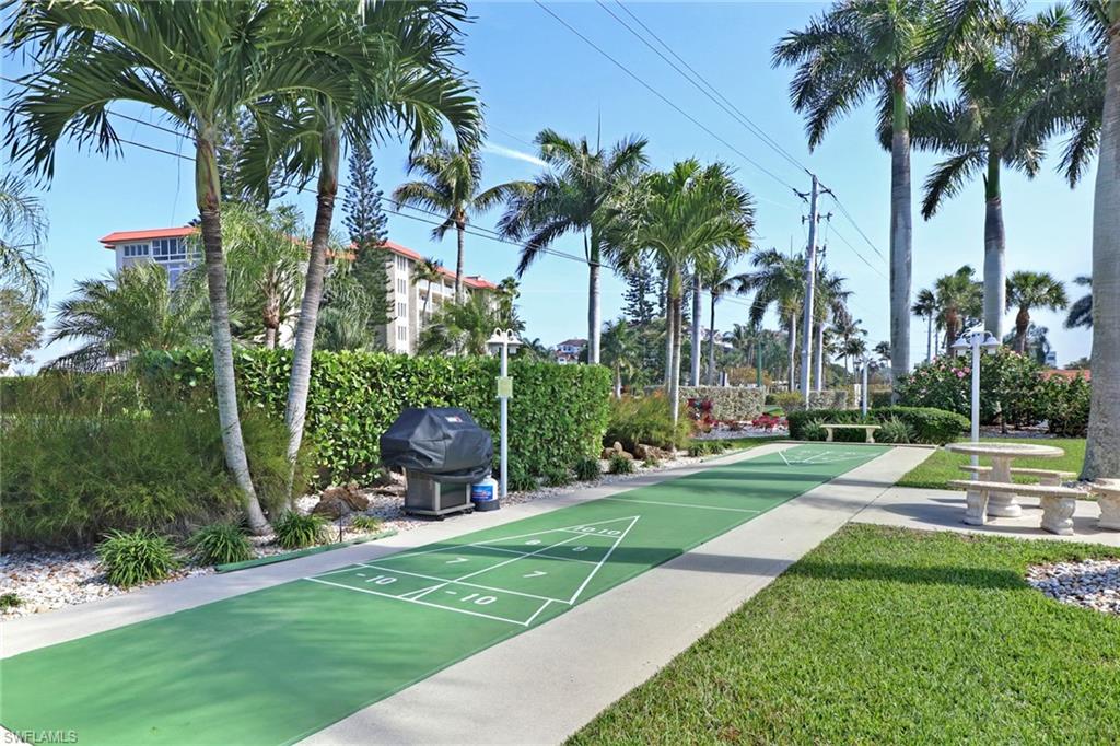 View of home's community with shuffleboard