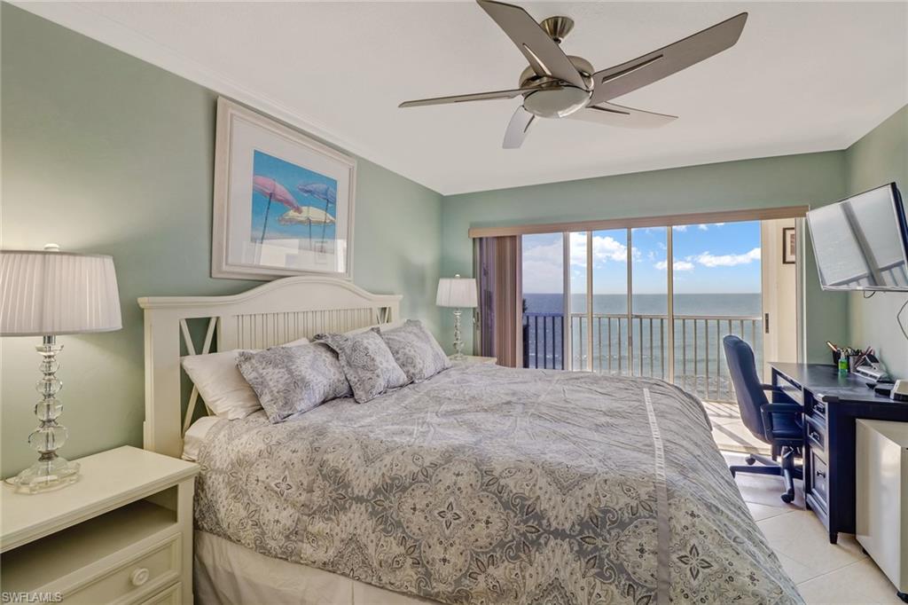 Bedroom with a desk, access to outside, ceiling fan, and light tile patterned floors