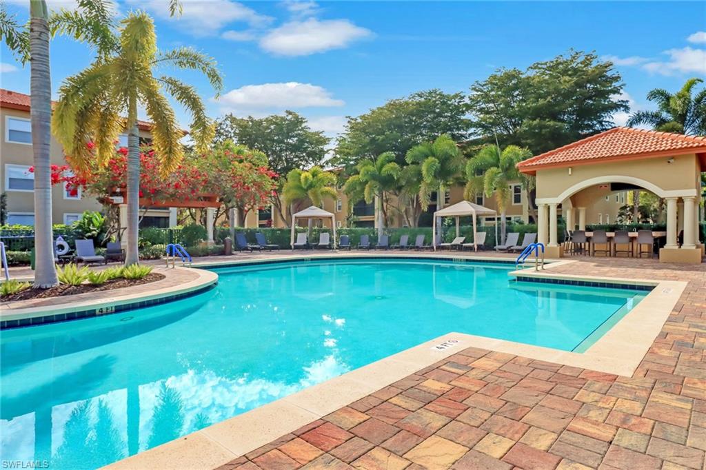 Community pool featuring a gazebo and a patio