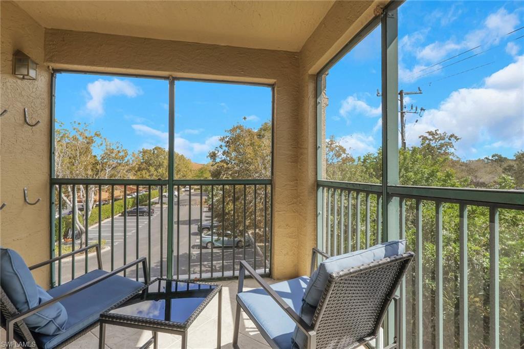 Sunroom featuring a balcony