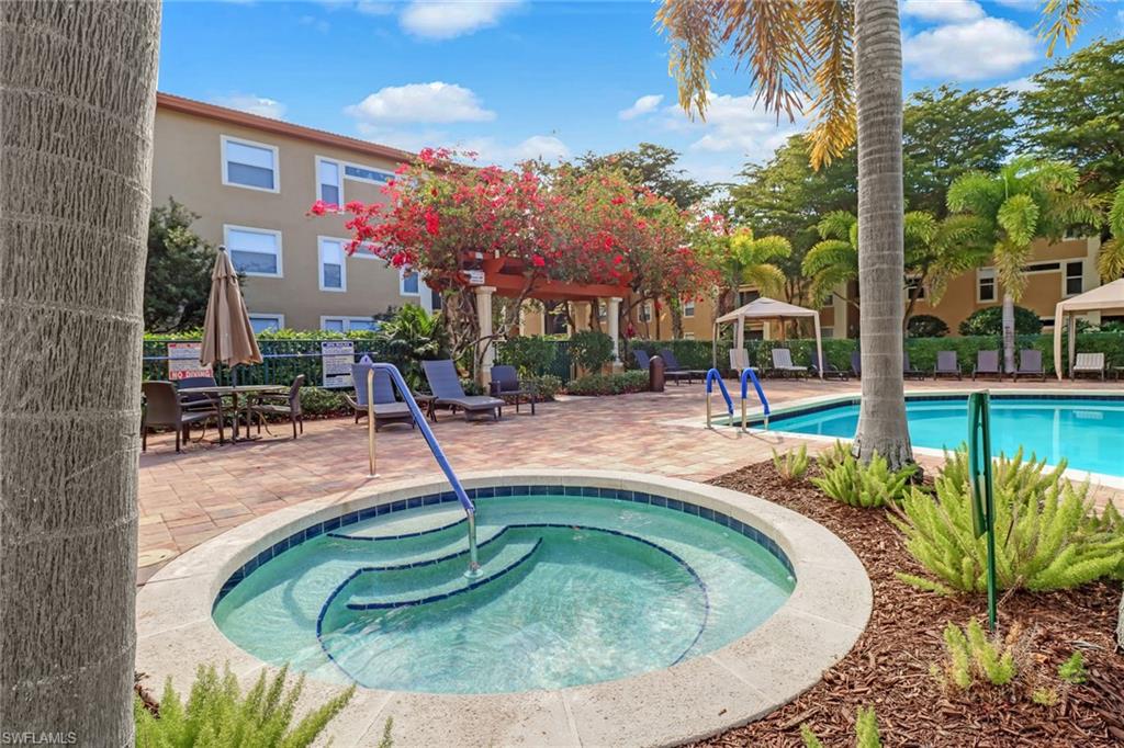 Community pool featuring a gazebo, a community hot tub, and a patio area