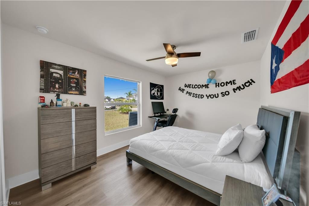 Bedroom with light wood-style floors and ceiling fan