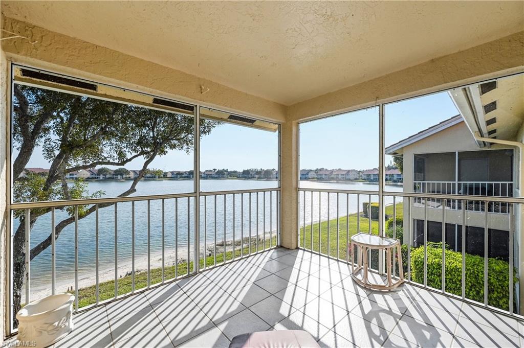 Sunroom / solarium with a water view