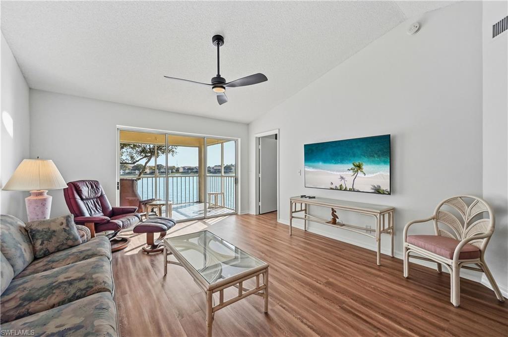 Living room featuring wood finished floors and a ceiling fan