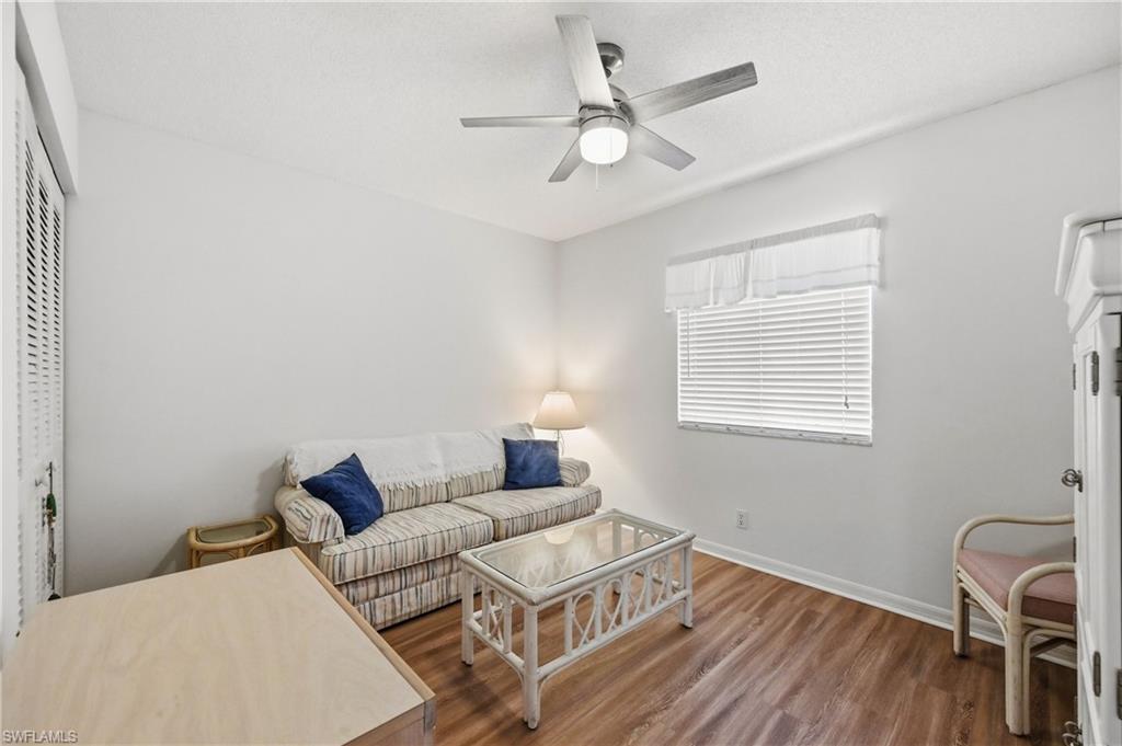 Bedroom with wood finished floors and a ceiling fan