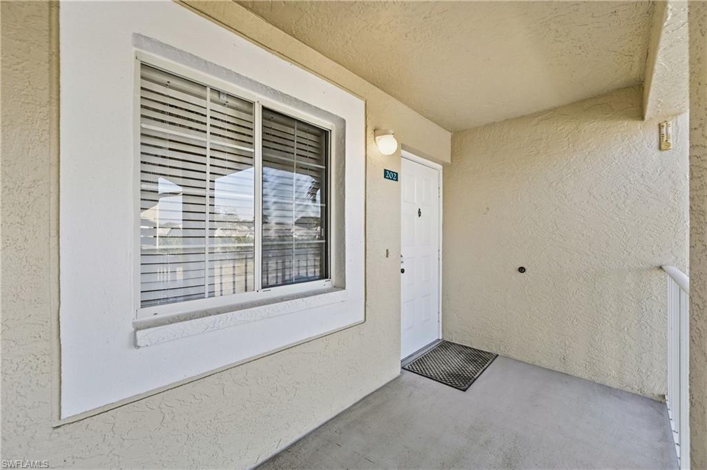 Entrance to property featuring stucco siding