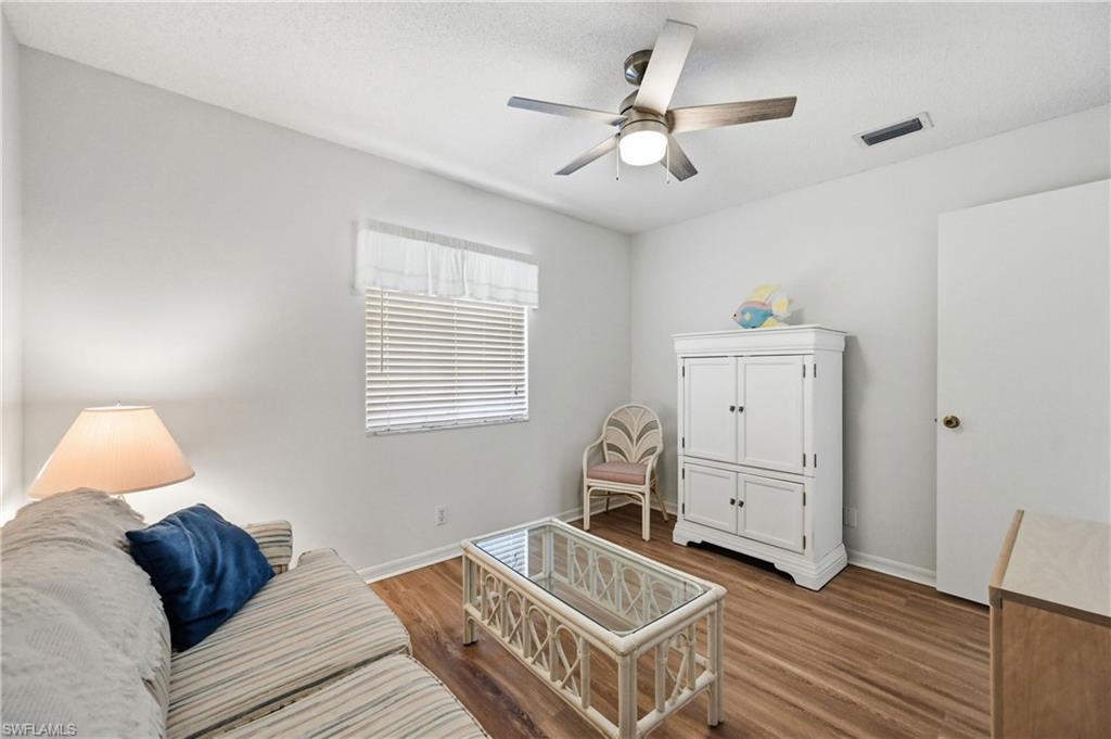 bedroom featuring dark wood finished floors and a ceiling fan