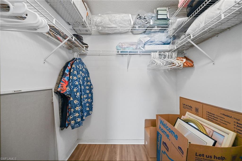 Walk in closet featuring light wood finished floors