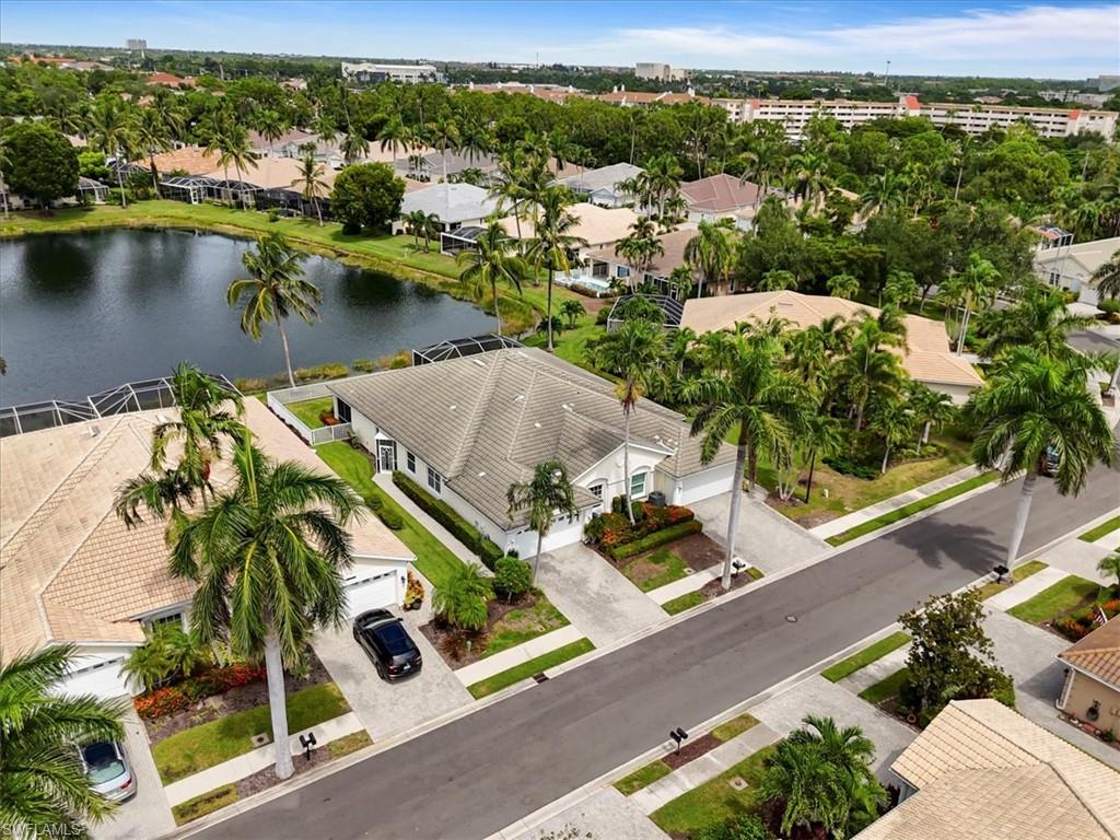 Aerial perspective of suburban area with a nearby body of water