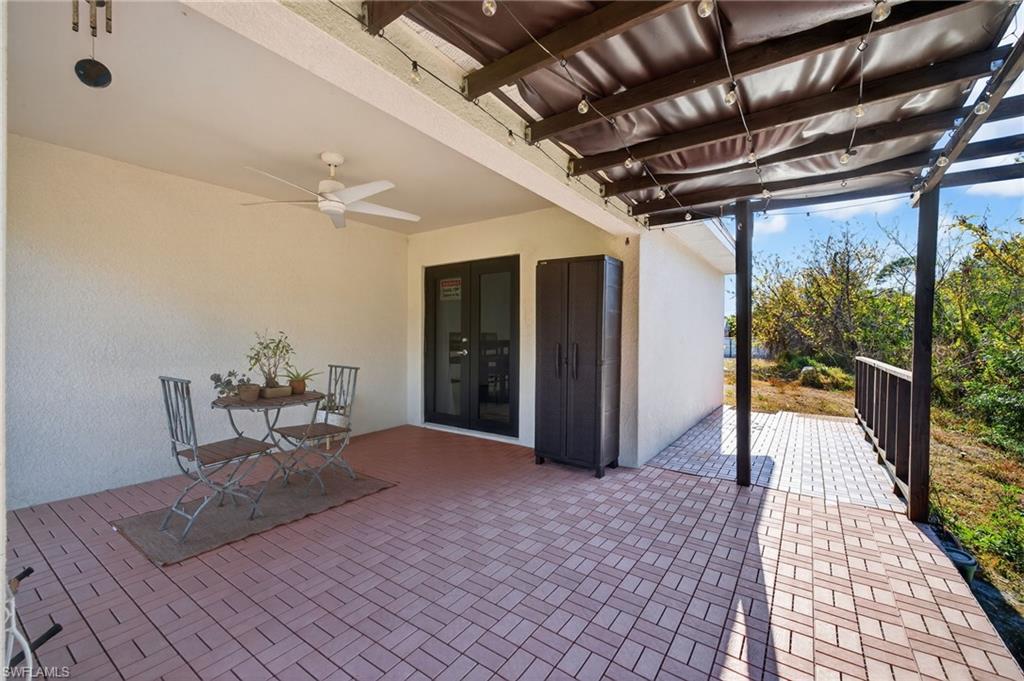 View of patio featuring ceiling fan