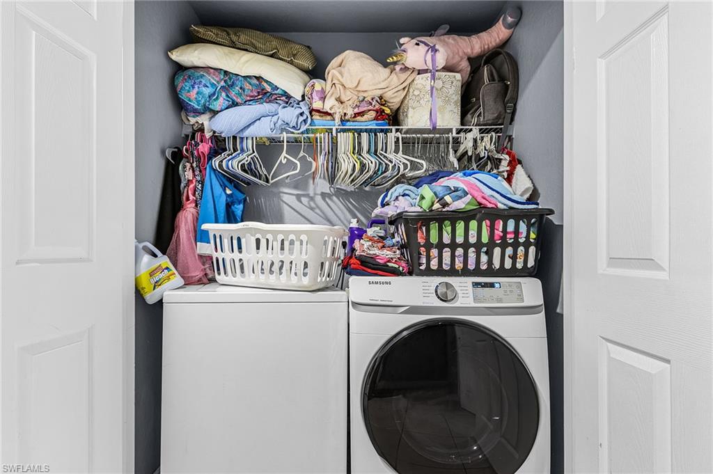 Laundry area featuring washer and clothes dryer