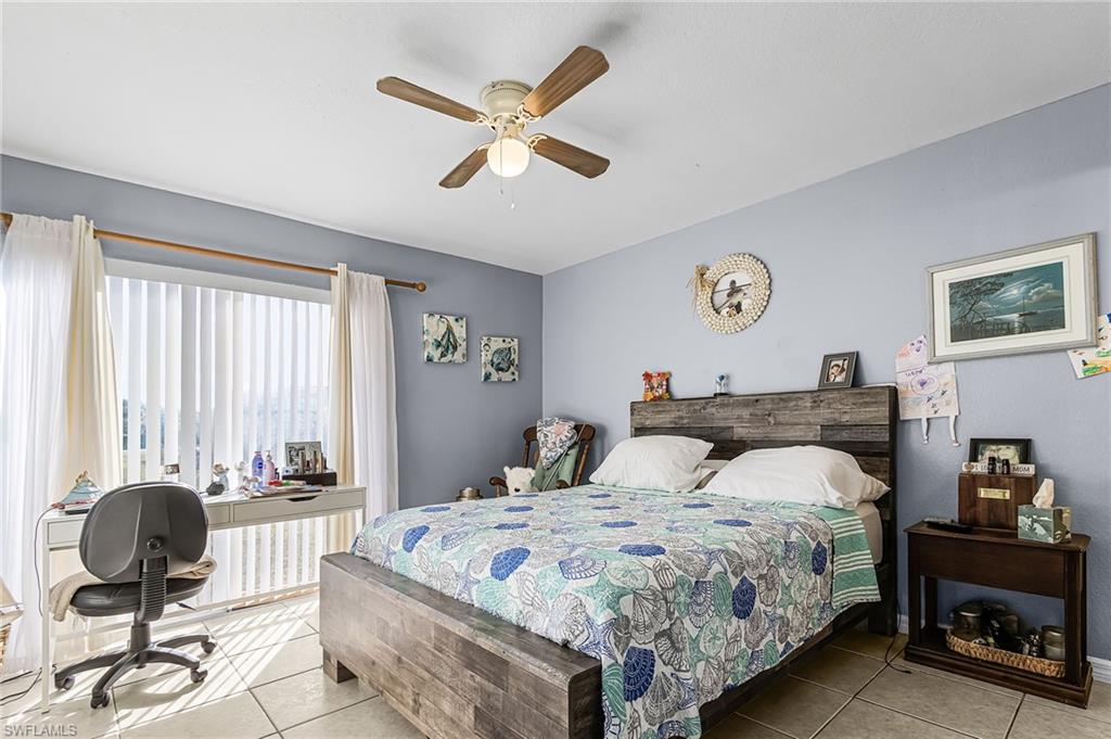Tiled bedroom with ceiling fan