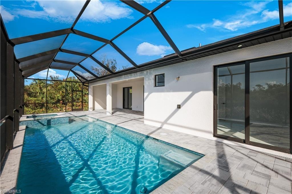 View of pool and spa at finished home