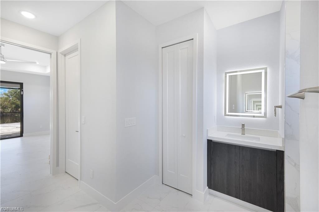 His-Her walk in California closet in finished home