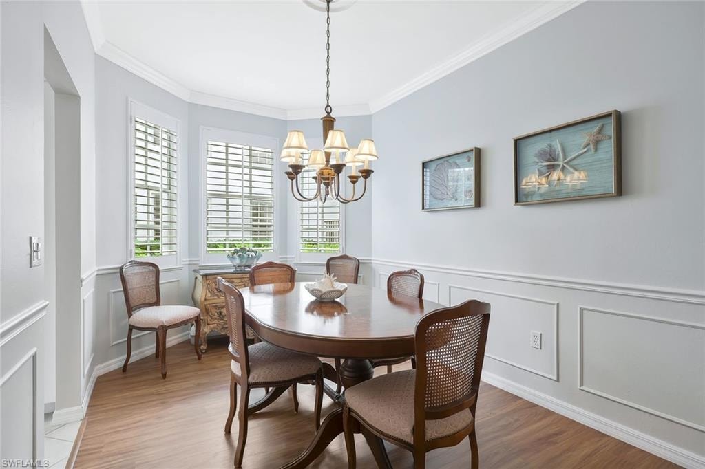 Plantation shutters on bay window with lovely molding details.