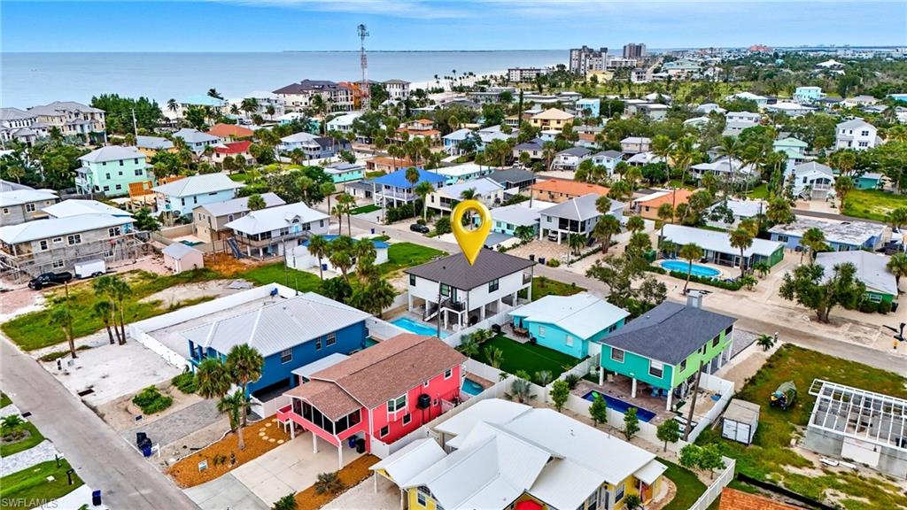Aerial view of residential area featuring a nearby body of water - Virtually Edited Image
