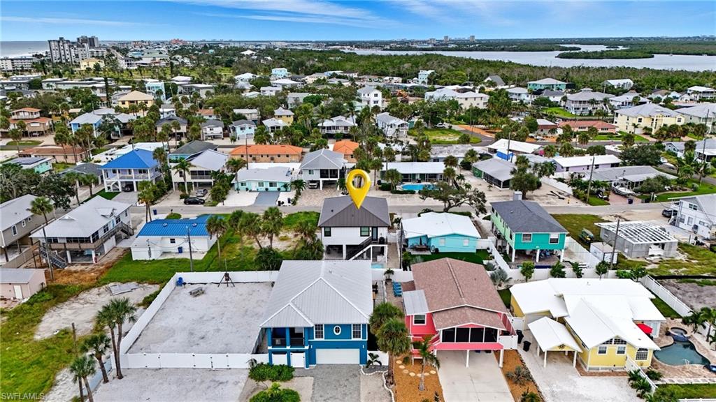 Aerial perspective of suburban area with a large body of water - Virtually Edited Image