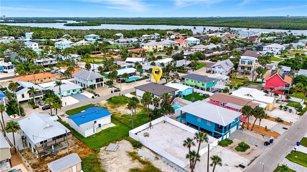 Aerial perspective of suburban area with a large body of water - Virtually Edited Image