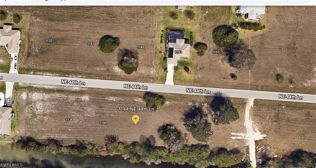 Aerial overview of property's location with property parcel outlined