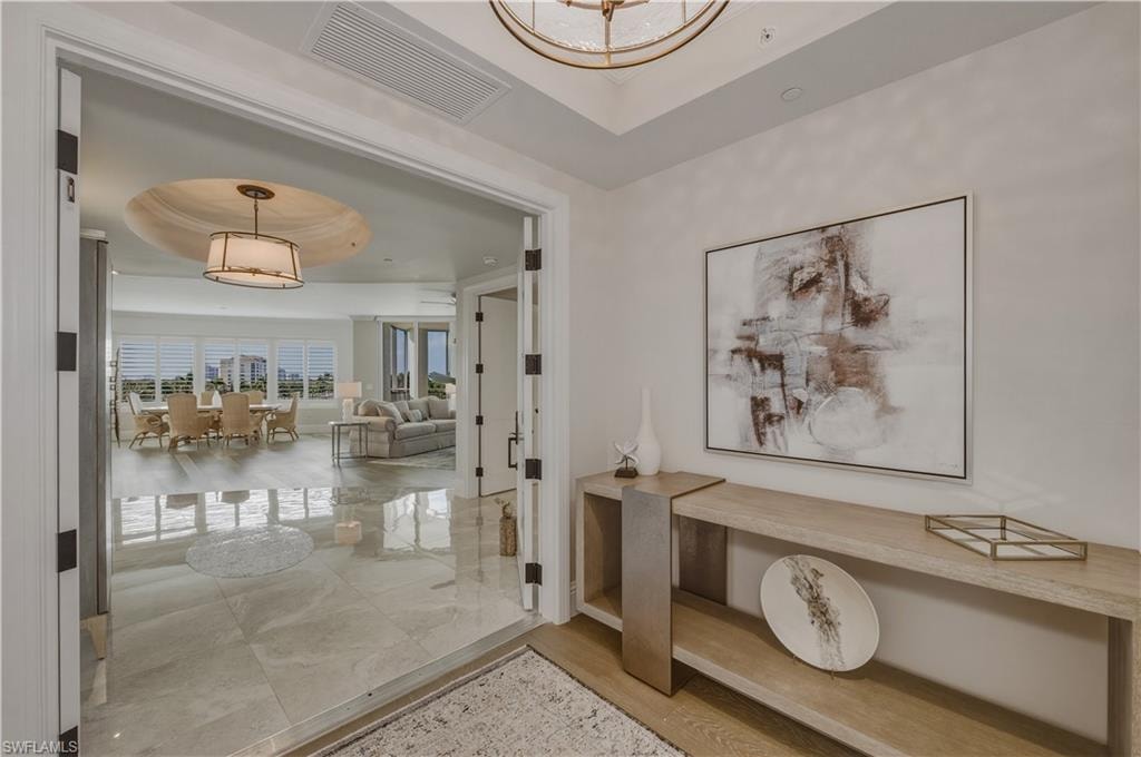 Hall with a tray ceiling