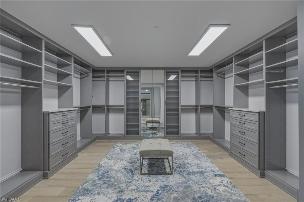 Walk in closet featuring light wood-style flooring