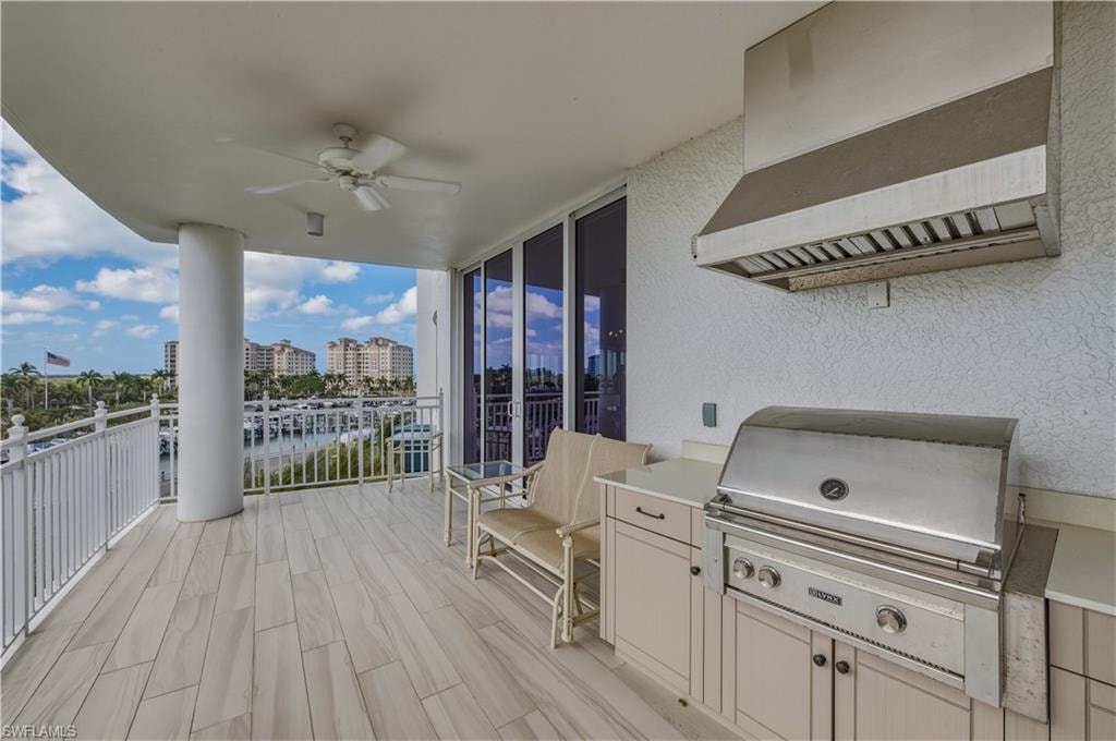 Deck featuring a grill, ceiling fan, and a patio area