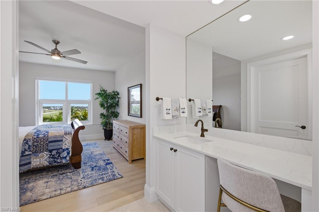 Bathroom with vanity, light wood-style flooring, ensuite bathroom, recessed lighting, and a ceiling fan
