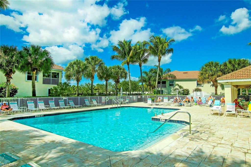 Community pool with a patio