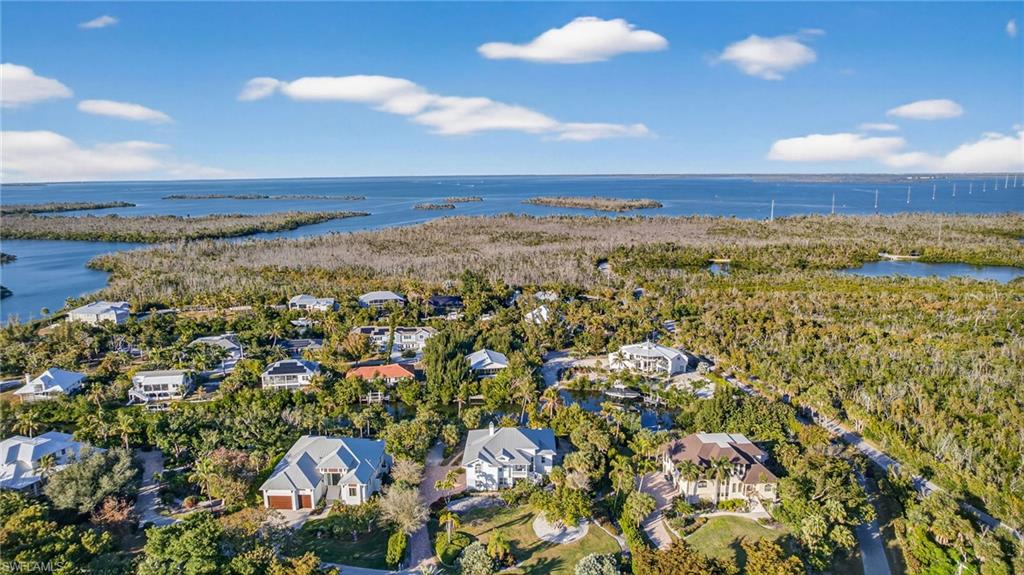 Aerial view of residential area with a nearby body of water