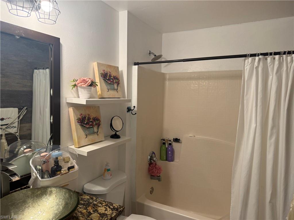 Guest full bathroom with vanity and shower / bath combination