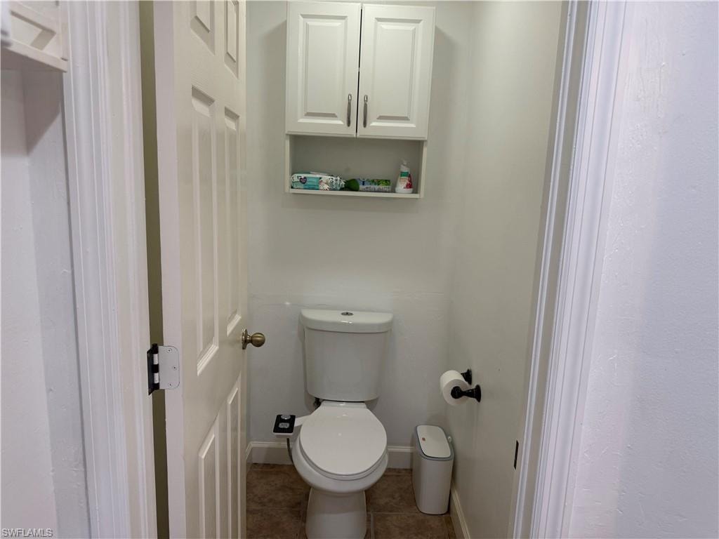 Master bathroom featuring private toilet