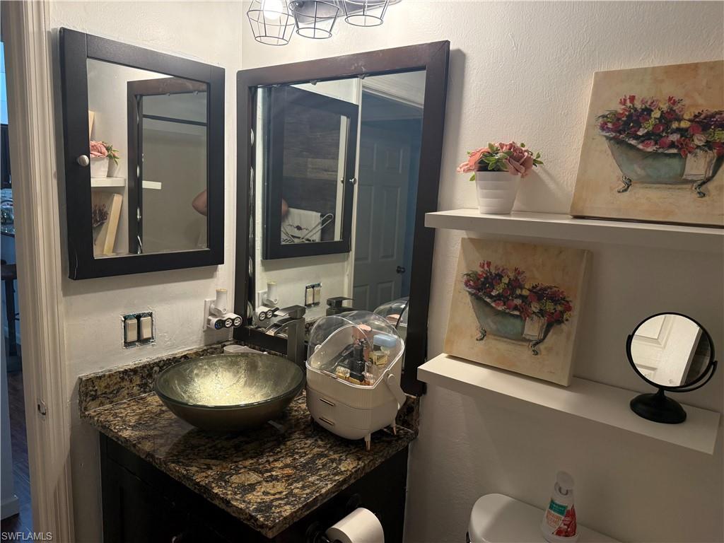 Gust bathroom with single sink vanity