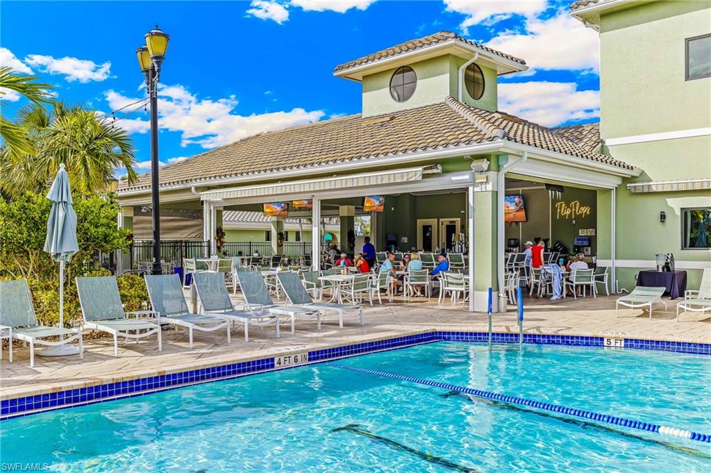 Community pool with a patio