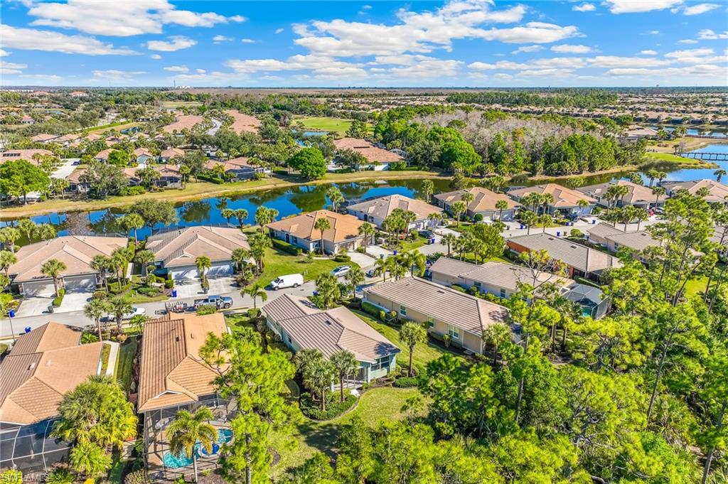 Aerial view of residential area featuring a large body of water