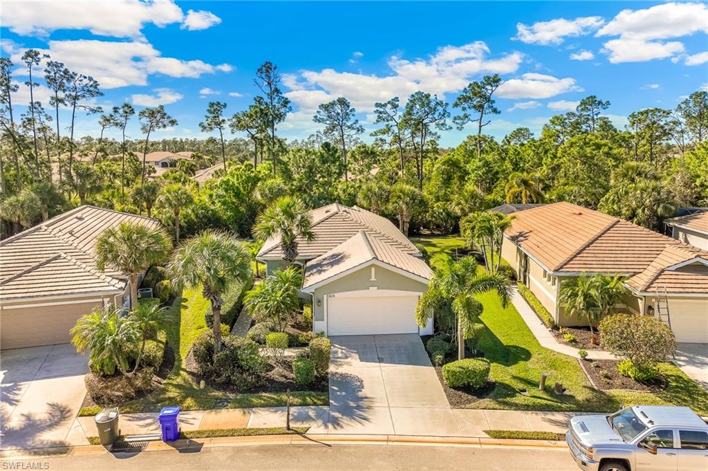 Aerial perspective of suburban area featuring a tree filled landscape