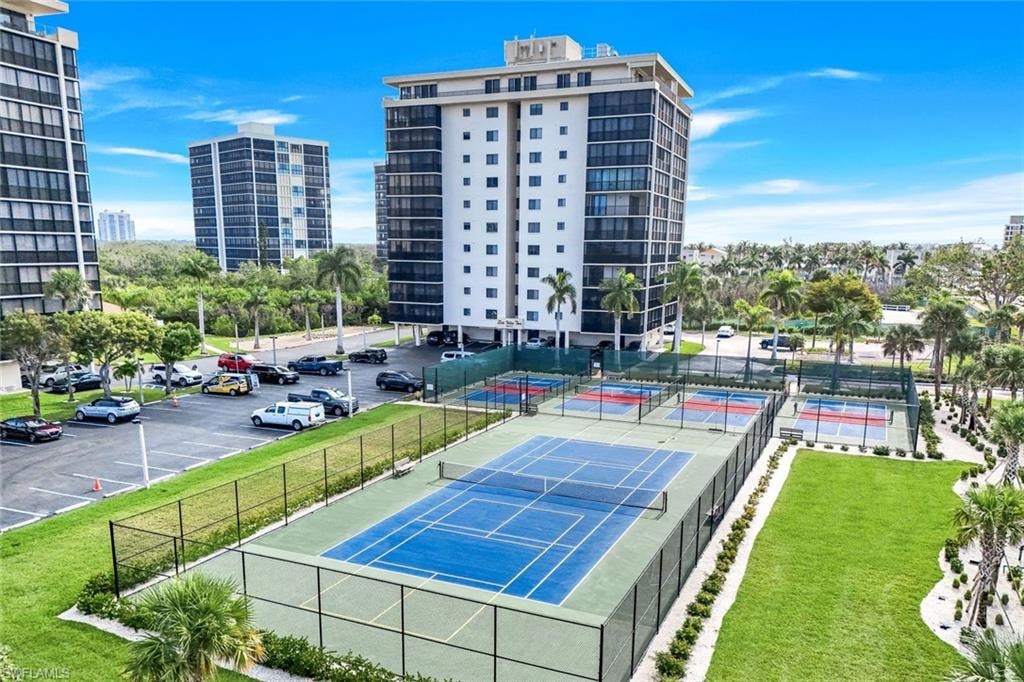 View of tennis court with a view of city