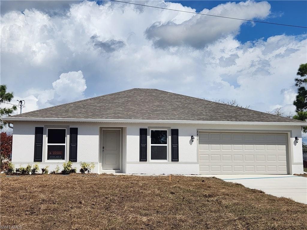 Ranch-style home with stucco siding, driveway, a garage, and roof with shingles