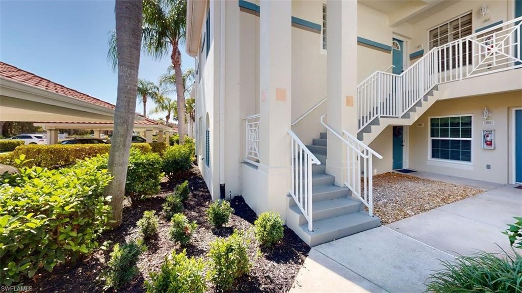Doorway to property featuring stucco siding