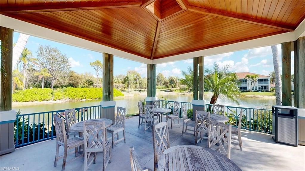 View of patio / terrace featuring outdoor dining space and a water view