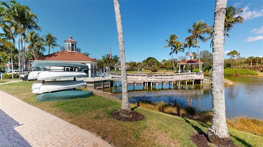 Dock featuring a water view and a lawn