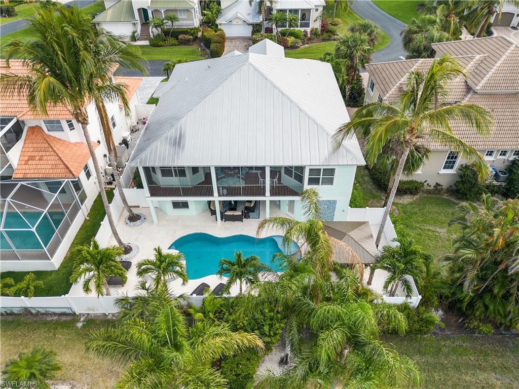 View of subject property featuring a pool area