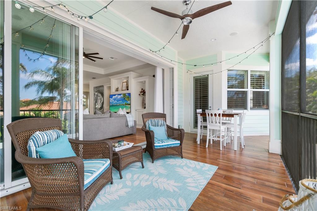 Sunroom featuring ceiling fan and outdoor lounge area